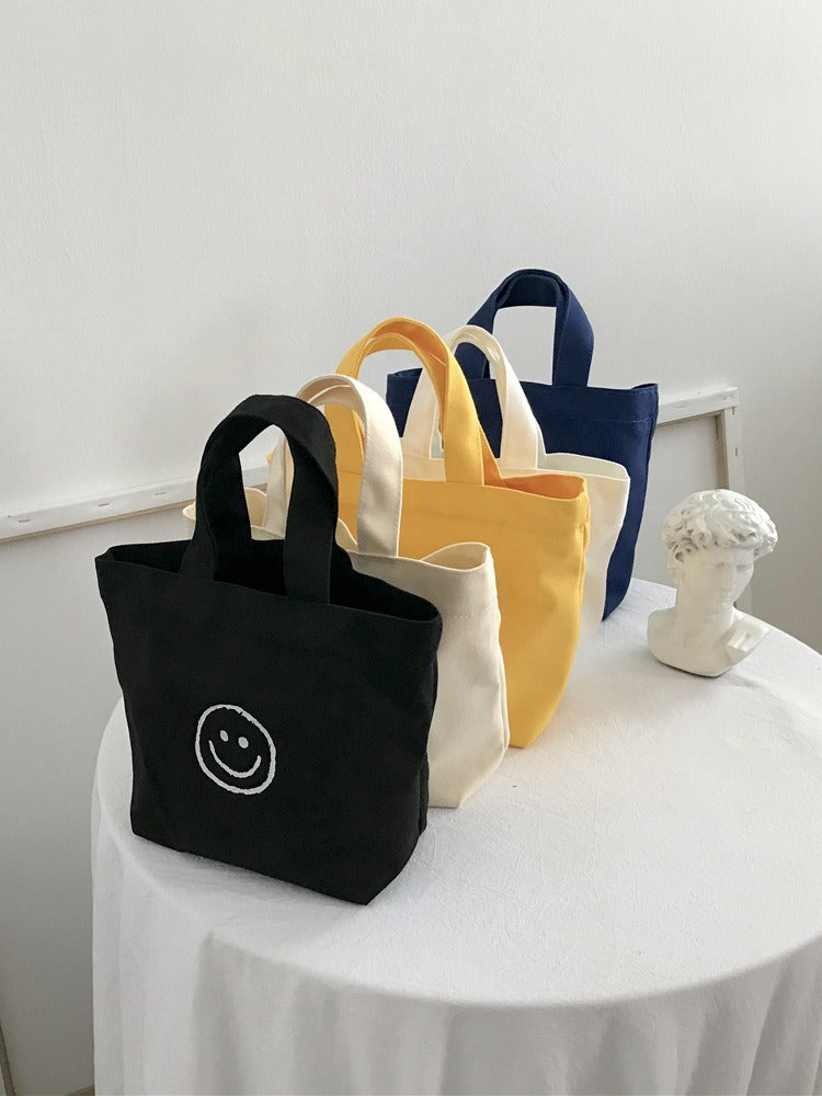 Women's Canvas Cute Smiley Face Simple Lunch Handbags