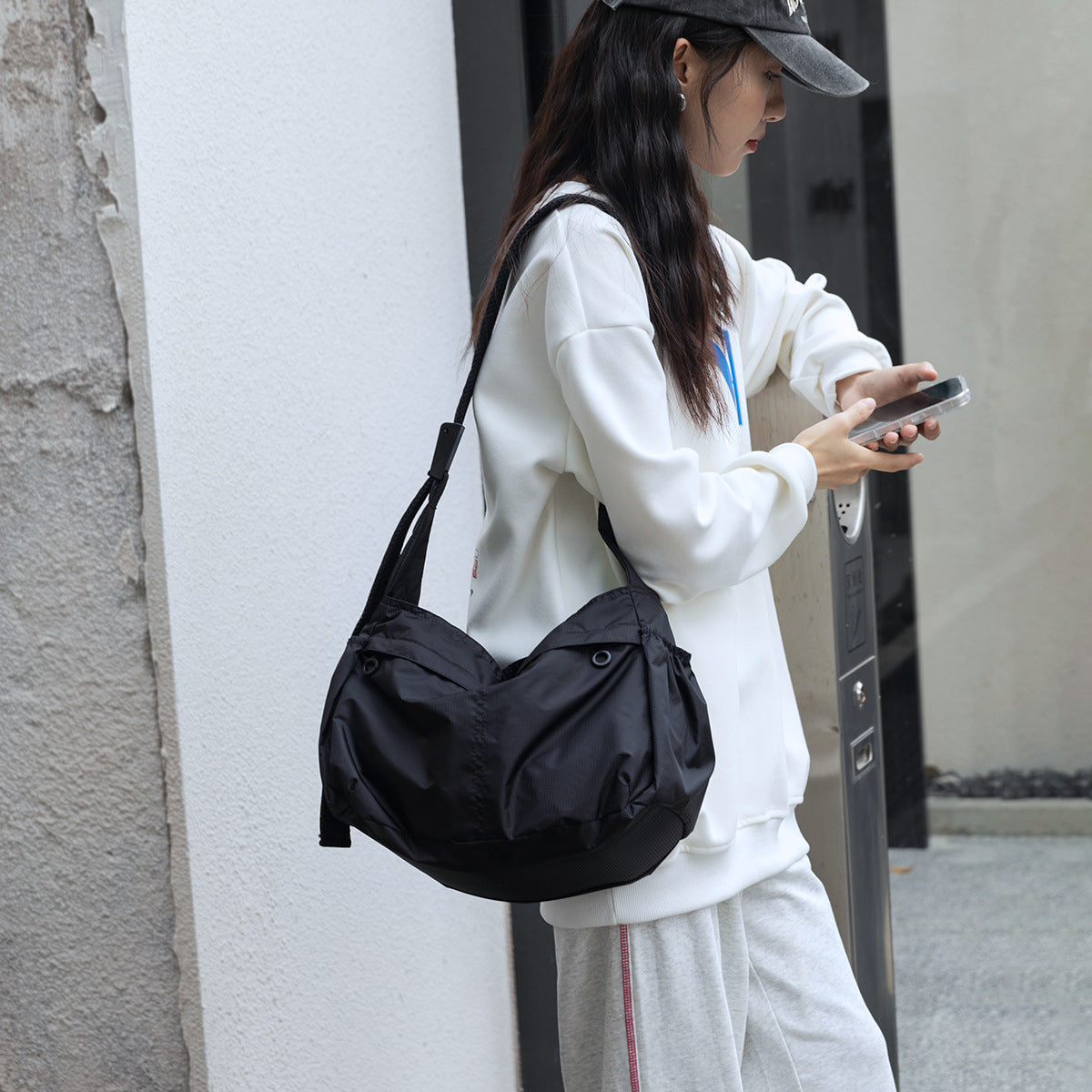 High-grade Nylon Dumpling Unisex Simple Style Crossbody Bags