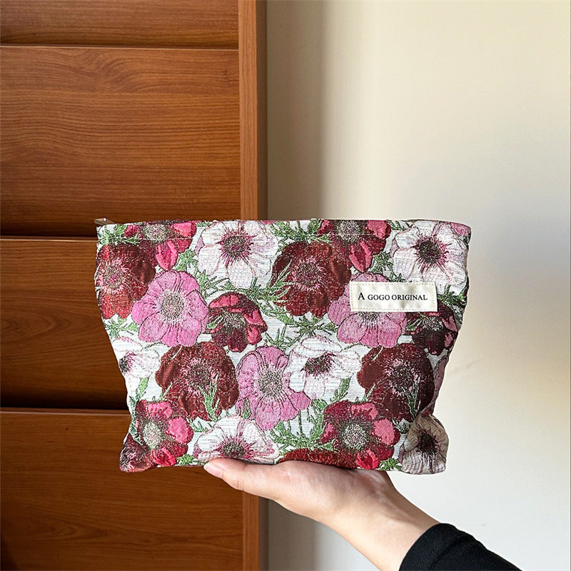 High-grade Artistic Jacquard Lady's Flower Clutch Good-looking Portable Makeup Bag