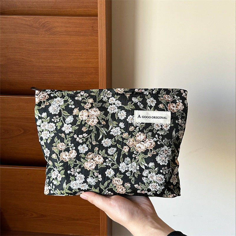 High-grade Artistic Jacquard Lady's Flower Clutch Good-looking Portable Makeup Bag